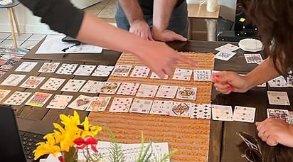 game spread out on a table with players surrounding
