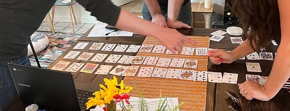 game spread out on a table with players surrounding